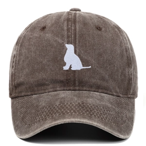 Close-up of vintage brown washed cotton baseball cap with white dog embroidery details