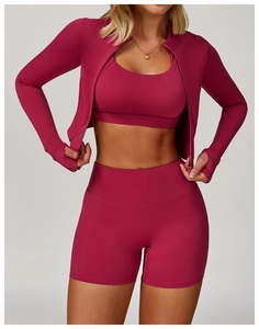 Three-piece rose red yoga set with zip jacket, sports bra and high-waisted shorts