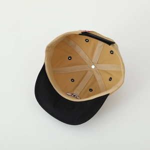 Detailed interior of a soft cotton puppy baseball cap showing khaki stitching and embroidery