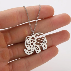 Detailed close-up of a silver hollow elephant pendant on a delicate chain necklace