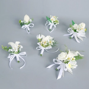 Set of 6 white calla lily and rose wedding boutonnieres with elegant white ribbon bows