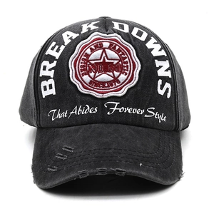 Close-up of distressed brim details and vintage embroidery on charcoal baseball cap