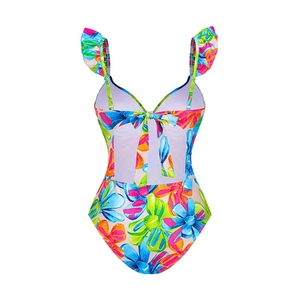 Detail of vibrant floral swimsuit featuring ruffle straps and a lace-up cutout back