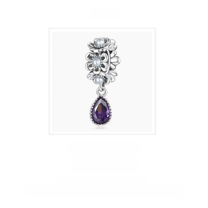 Macro detail of S925 silver floral charm with white pearls and purple water drop gemstone