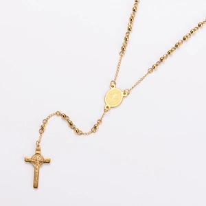 Detailed close-up of golden stainless steel rosary necklace with cross and medal charms