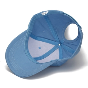 Detail view of cotton baseball cap interior showing 100% cotton label and reinforced stitching