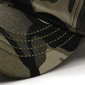 Close-up of camouflage baseball cap brim with four parallel precision stitching lines