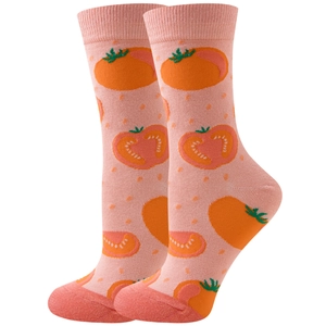 Detailed knit texture of pink crew socks featuring vibrant orange tomato patterns