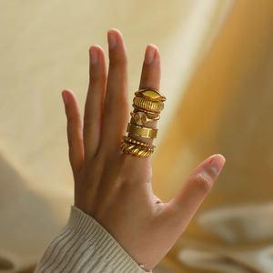 Set of gold stainless steel rings in minimalist textured and twisted designs for women