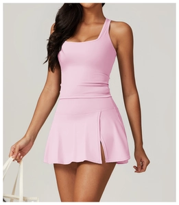 Detailed view of pink sports set featuring U-neck tank top and side slit mini skirt