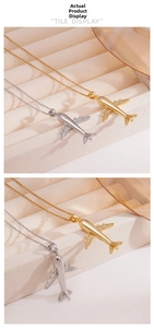 Detail showing gold and silver airplane pendants with micro-pave cubic zirconia crystals