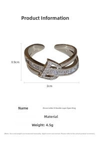 Macro detail of a double-layer ring featuring a zircon-inlaid D-shaped design and silver finish