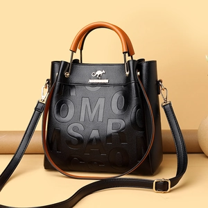 Litchi pattern black leather tote bag with orange contrast handles and gold kangaroo logo