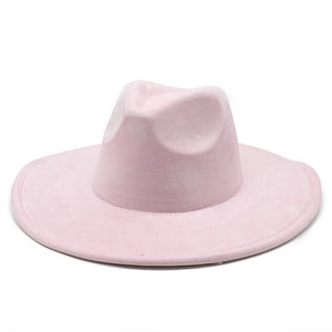 Detail of a pink suede wide-brim fedora hat with a teardrop crown and precise stitching