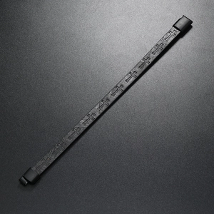 Detail of black woven leather bracelet with cross pattern and magnetic metal clasp