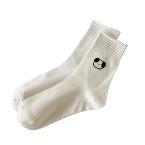 White crew socks with cute black cartoon dog embroidery made of soft knitted cotton