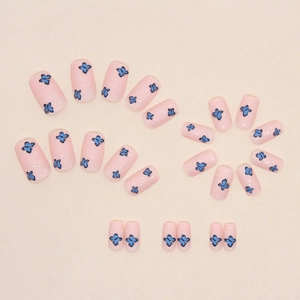 Medium square press-on nails with light pink base and delicate blue butterfly patterns