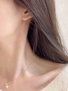 Close-up of s925 silver percentage necklace and earrings with freshwater pearls