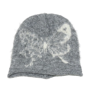 Close-up of gray knitted beanie featuring soft mohair texture and large white butterfly
