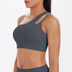 Detailed side view of dark grey one-shoulder sports bra with stylish cutout design
