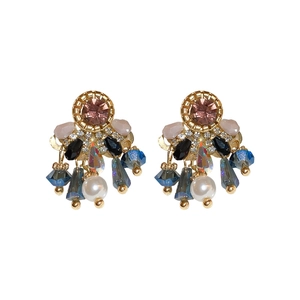 Vintage gold drop earrings with pink crystals and colorful beaded tassels on white background