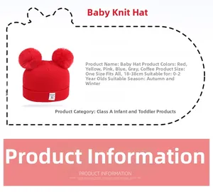 Detail of red knit baby hat with faux fur pom-poms for infants aged 0 to 2 years