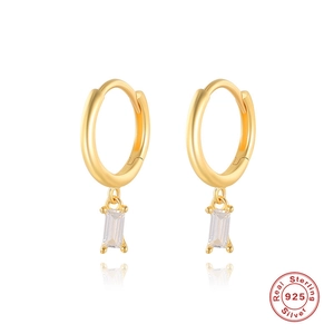 Detail of 925 sterling silver gold hoop earrings with rectangular zircon pendant