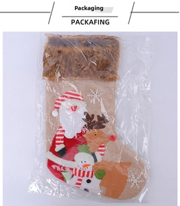 Christmas stocking with Santa and reindeer motifs in clear packaging