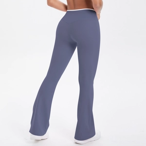 Detail view of high-waist flared yoga pants with white piping and butt-lifting seam