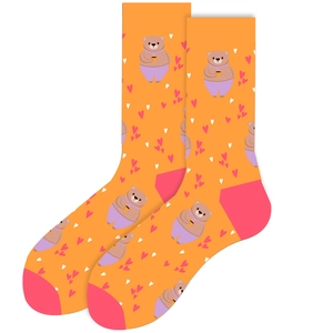 Detailed view of orange mid-calf socks with cute cartoon bear and heart prints
