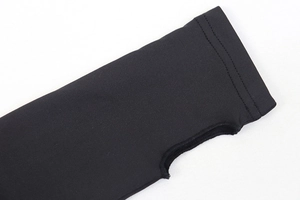 Detail of black thumbhole cuff on high elastic jumpsuit with fine stitching and knit fabric