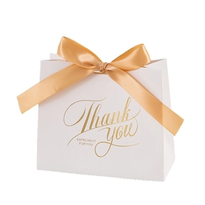 Elegant white wedding favor box with gold ribbon bow and printed Thank You message