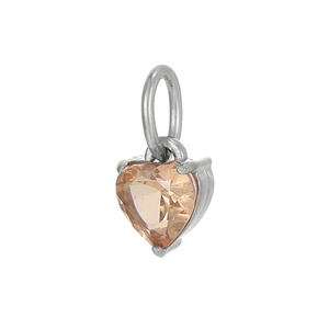 Macro shot of heart-shaped champagne zircon pendant with silver prong setting