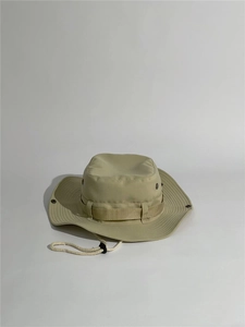 Detail of khaki outdoor sun hat with adjustable windproof rope and metal eyelets