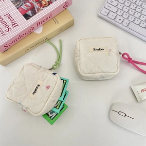 Soft quilted mini storage pouch for sanitary napkins with cute colorful embroidery details