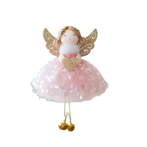 Christmas angel doll decoration with pink sequin dress and golden wings on white background