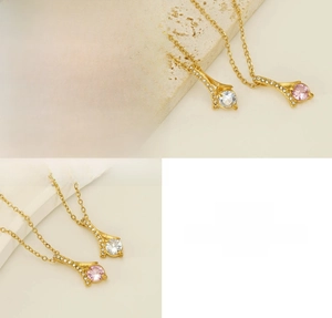 Detail view of titanium steel necklaces with pink and white zircon pendant stones