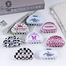 Set di 8 mollette per capelli in acrilico con motivi a scacchi e stampe leopardate