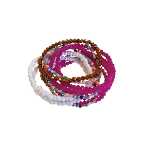 Bohemian multilayer bead bracelet set with pink and white resin beads on white background