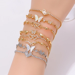 8Pcs set of gold and silver butterfly charm bracelets with crystal accents