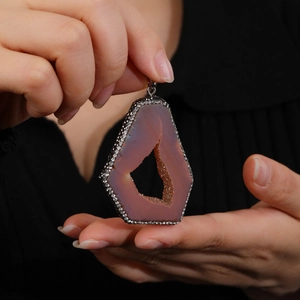 Natural geode agate slice pendant with sparkling pavé crystal edges and silver bail