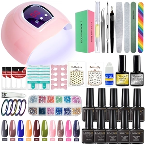 Complete nail starter kit with pink UV LED lamp gel polish set and manicure tools