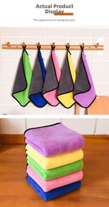 Close-up of double-sided microfiber pet towels in five vibrant colors with black piping