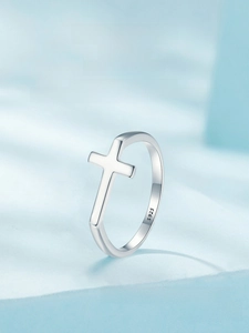Macro shot of S925 sterling silver ring showing precise religious cross and metal hallmark