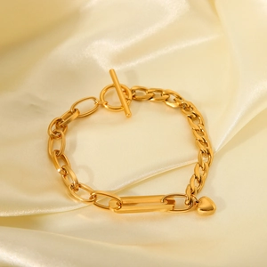 Gold stainless steel Cuban chain bracelet with heart pendant and OT toggle clasp on silk