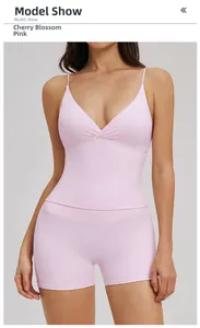 Detail of cherry blossom pink yoga set featuring a V-neck tank top and high waist shorts