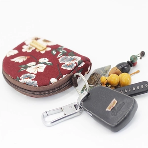 Floral fabric coin purse with key ring showing car keys and decorative pendants
