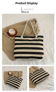 Detail of black and white striped woven tote bag with soft cotton rope handles
