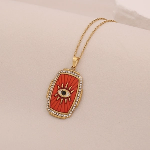 Collier avec pendentif œil maléfique doré, émail rouge et oxydes de zirconium