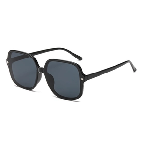 Retro square frame sunglasses with black frames, grey lenses and silver star rivets